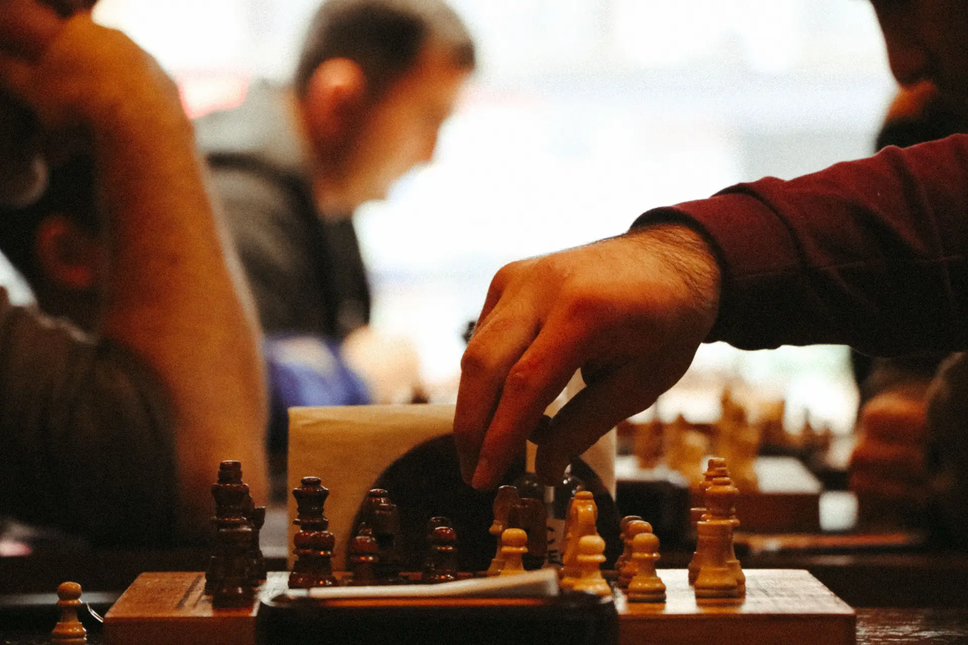 Hand moving chess piece