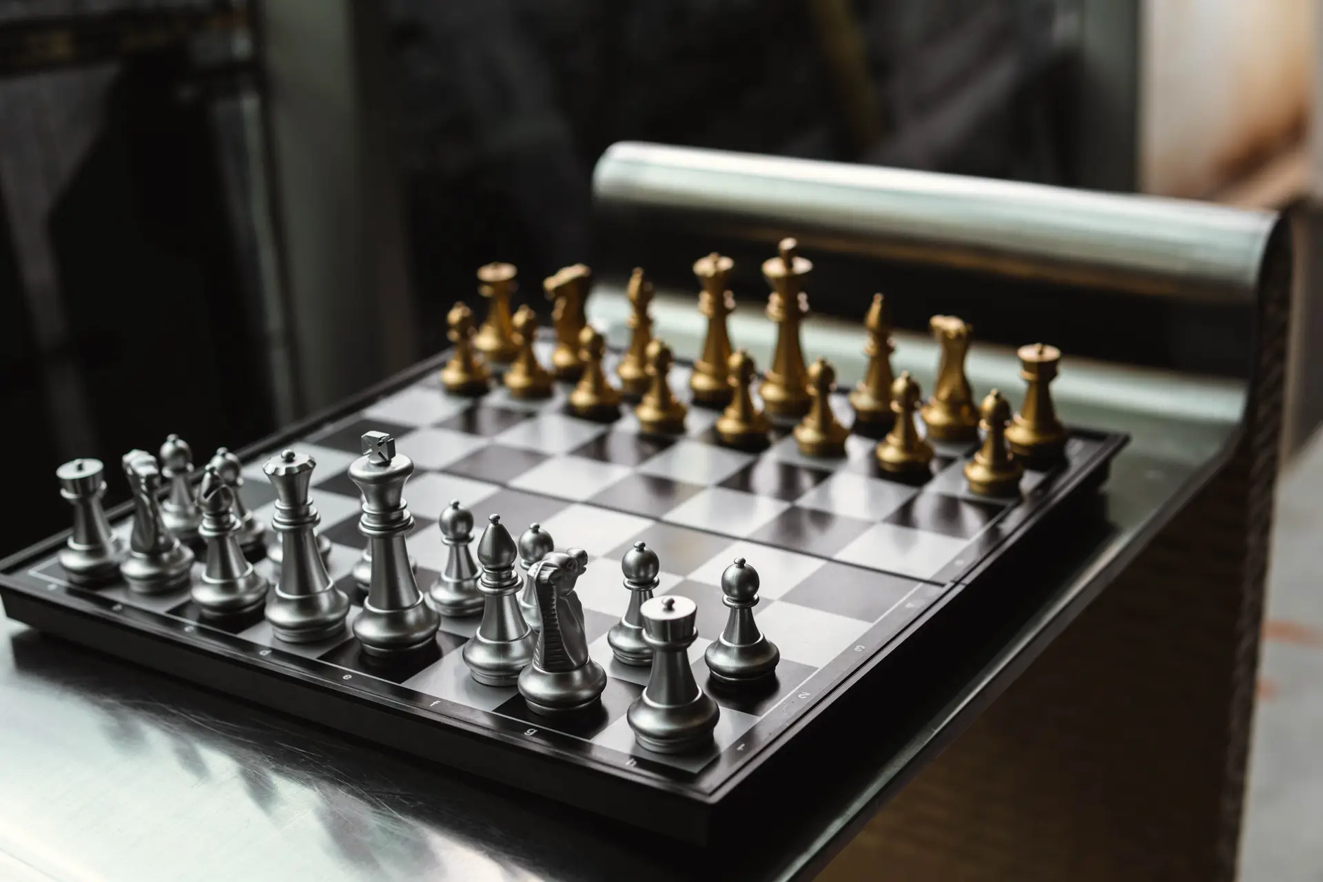 Elegant chessboard with gold and silver pieces